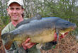 Andrew's PB carp - a 24lb 9oz leather carp caught on an exploratory trip to an unfished carp lake