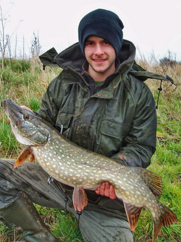 Craig with a double figure canal pike