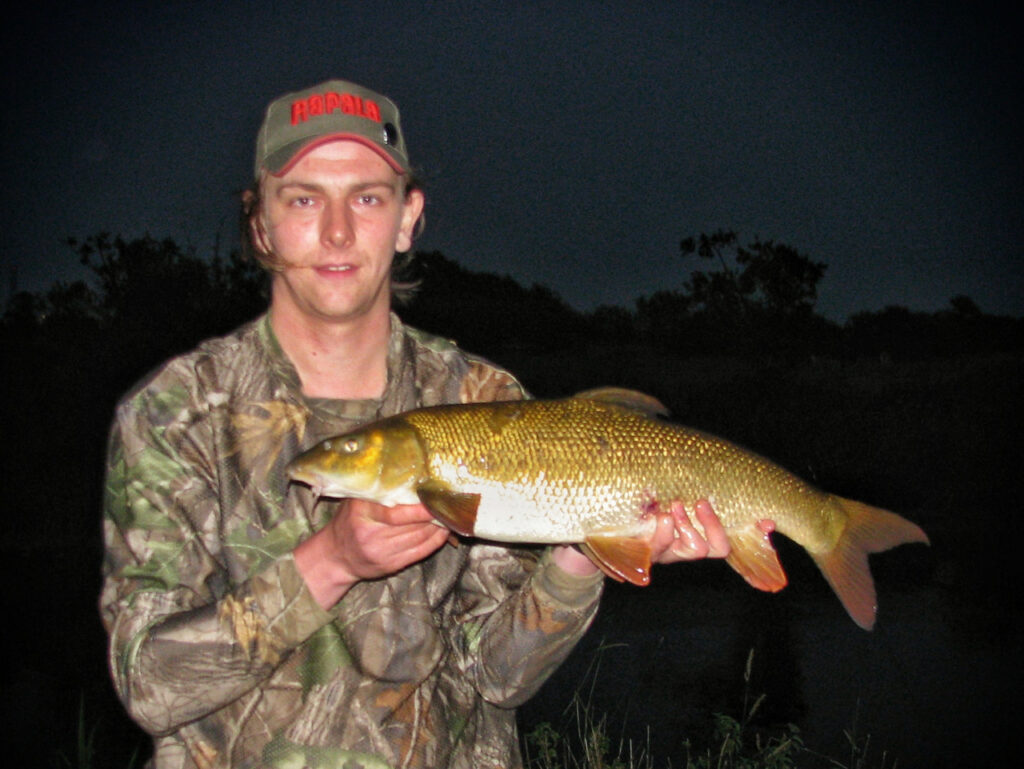 Andrew Kennedy with a Barbel caught on home made fishing bait