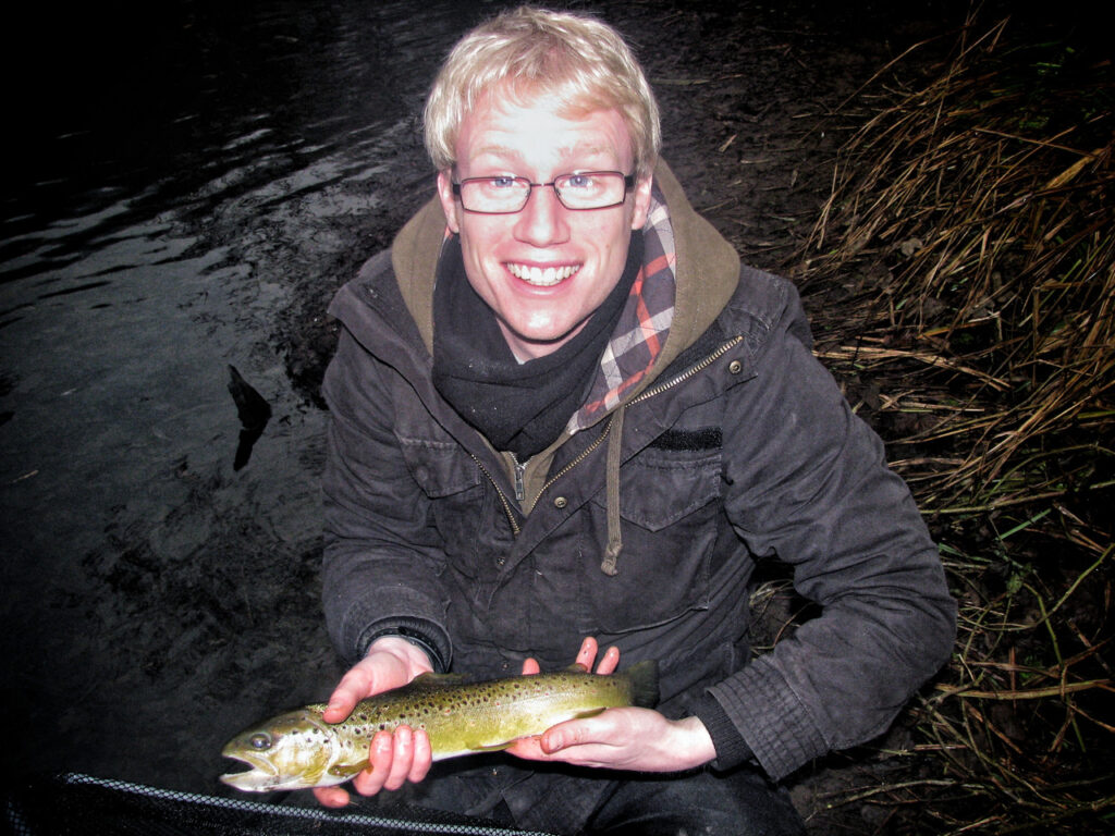 Titch with his first wild brown trout, from the River Derwent