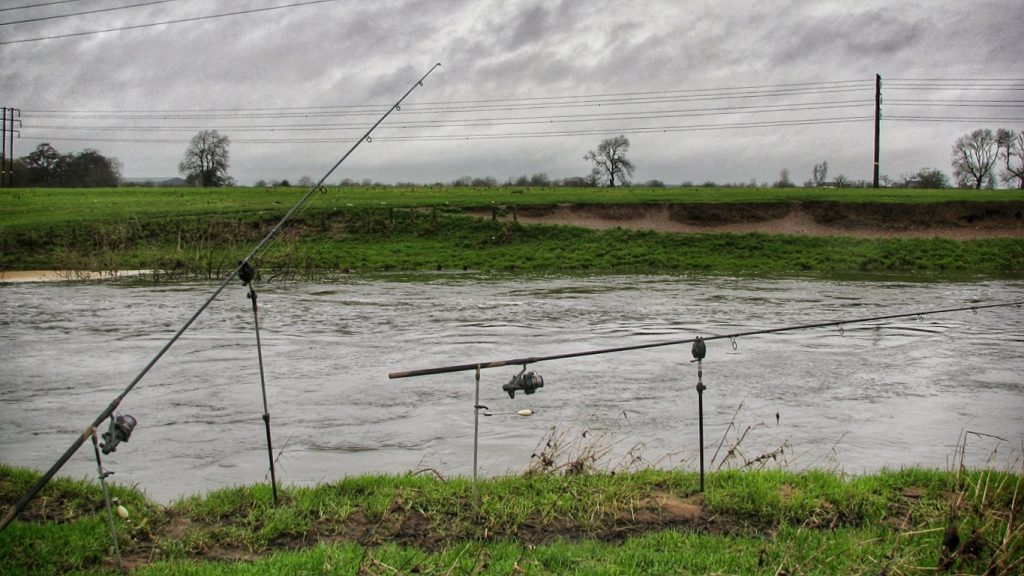 Pike fishing the River Dove in far from ideal conditions - coloured water, high flows and strong winds