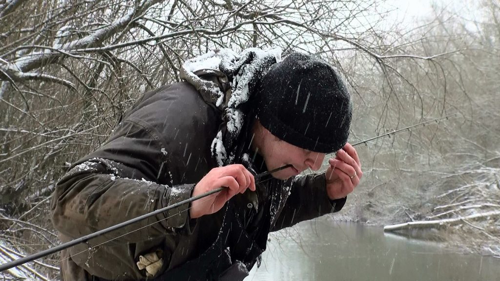 Stu Walker clears his rod rings of ice in Caught In The Act