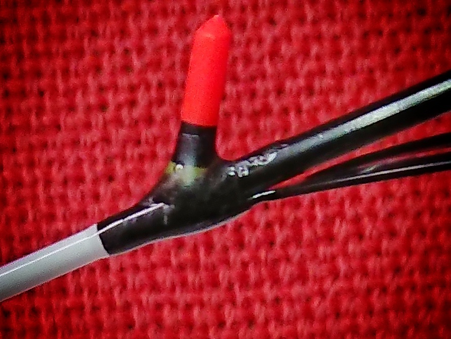 Epoxy resin supporting the joint between the sight tip and rod tip
