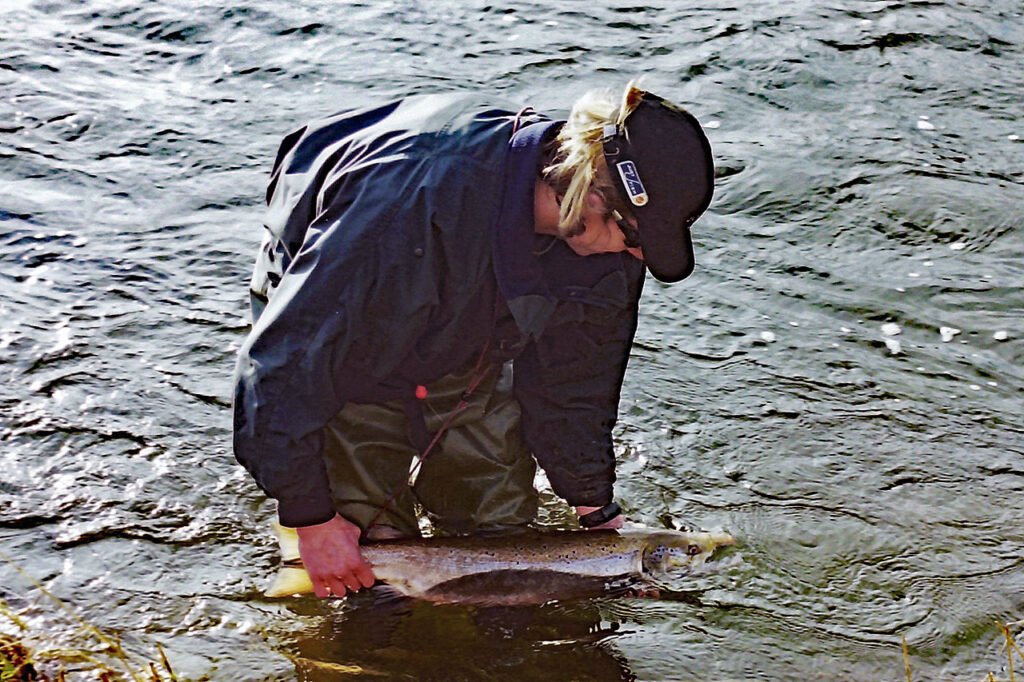 Andrew returning his PB salmon to the River Tweed